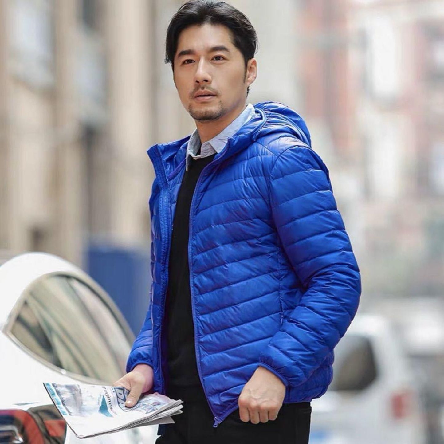 Royal blue men's lightweight down jacket, designed for modern urban chic.