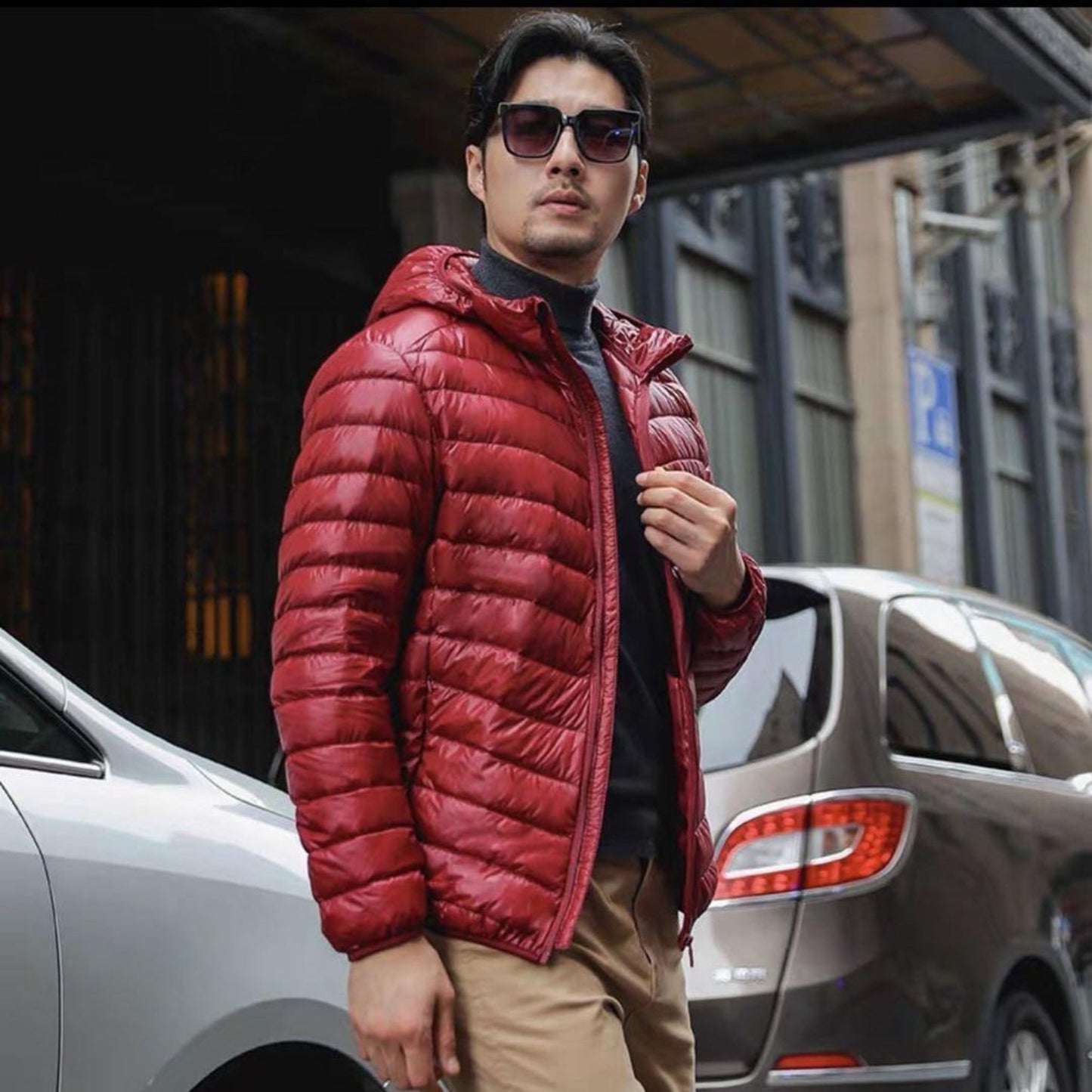 Burgundy lightweight down jacket highlighted against a stylish backdrop.