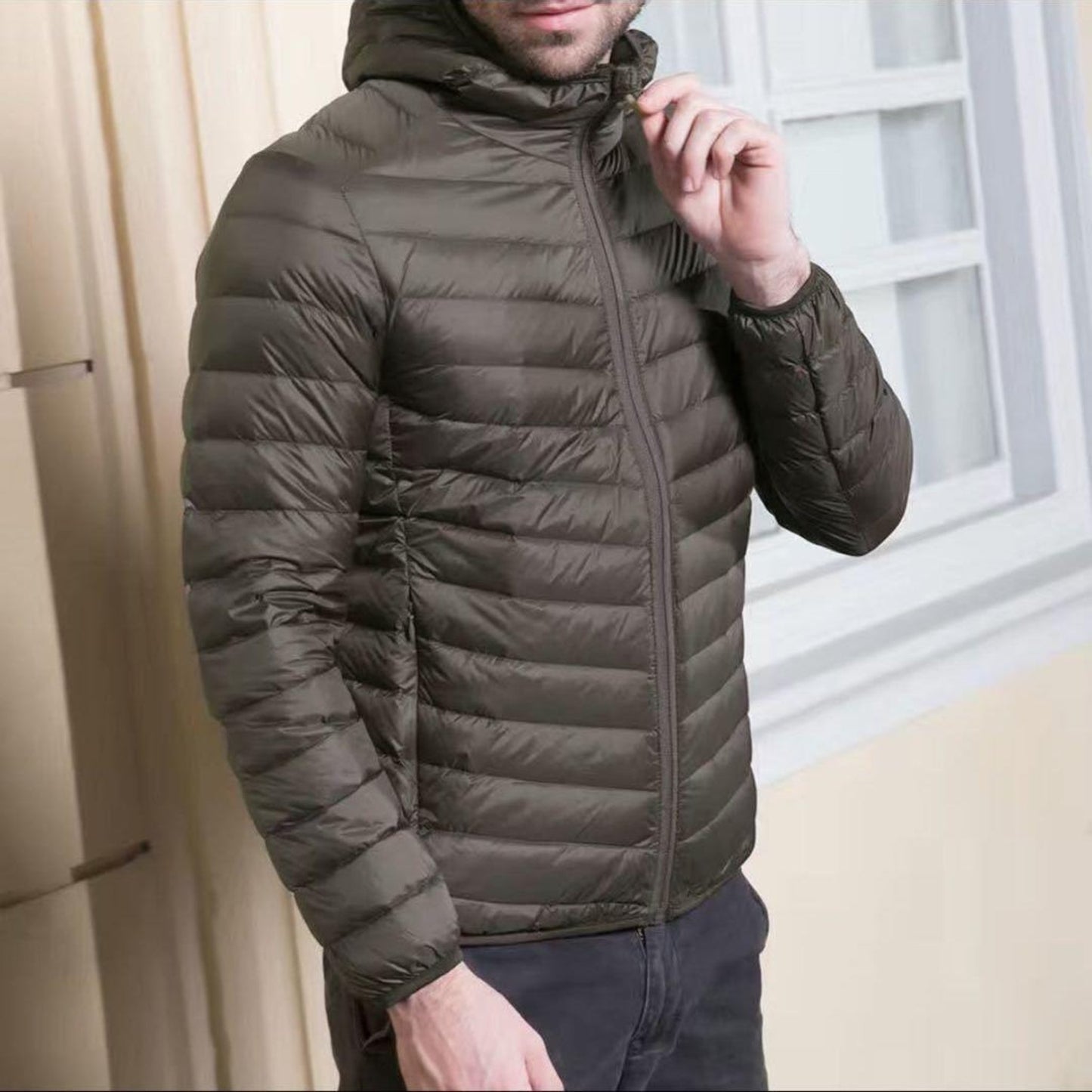 Model showcasing Army Green lightweight down jacket with a front zipper.