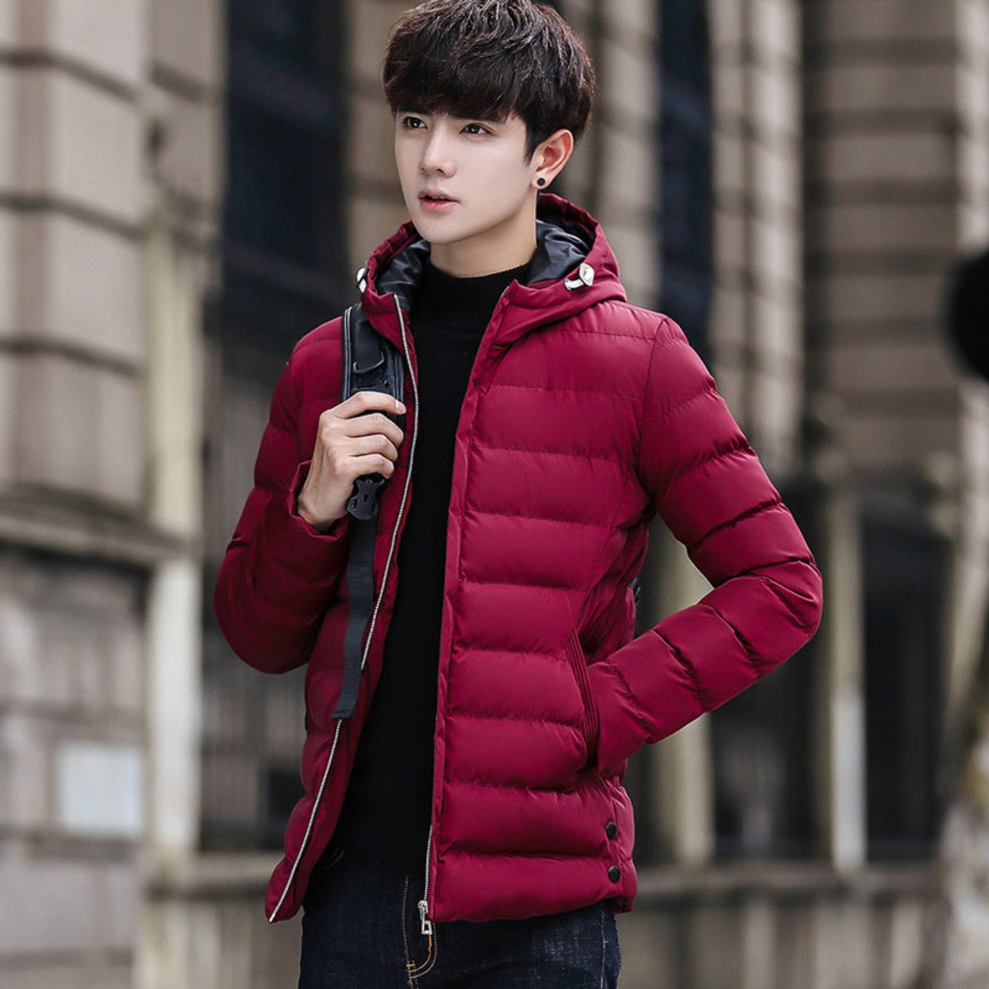 Model showcasing a wine-red cotton puffer jacket for cold-weather fashion.