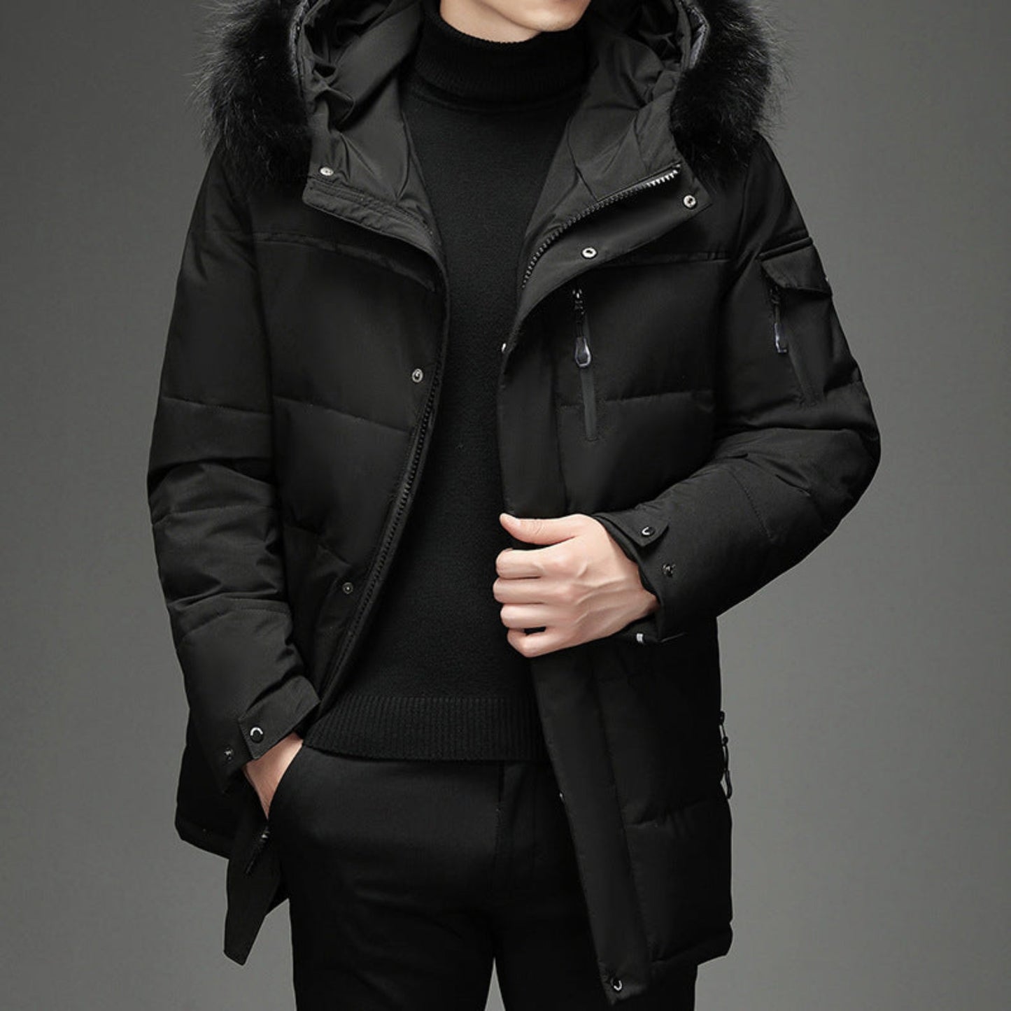 Full front view of the black long winter coat with a faux fur collar, worn by a model (slightly different pose from Image 1).
